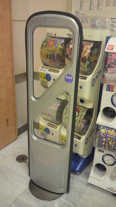 The Security gate is setting in front of Gacha Machine.